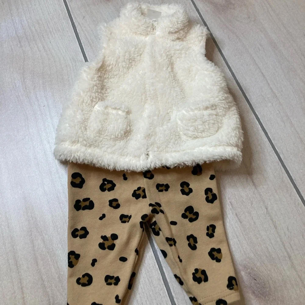 Carter’s. Fuzzy vest with leopard pants.